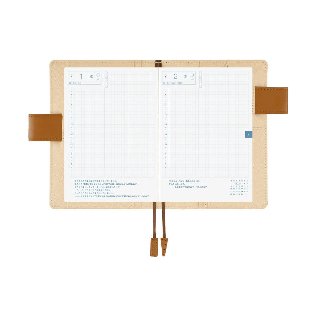 Hobonichi A6 planner interior with Japanese daily layout and attached pen holder strap