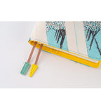 Close-up of Hobonichi A6 cover interior yellow lining and ribbon ties