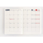 July 2024 grid calendar spread in Hobonichi Techo Day-Free A6 with Japanese day labels