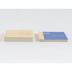 Beige and blue Hobonichi Techo 2024 A6 diaries side by side showing stitched binding edges