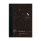 Front view of Hobonichi Graph Notebook A6 featuring white cat on wire with sparklers