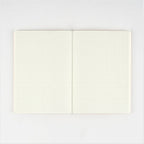 Hobonichi Techo Hiroko Kubota notebook opening completely flat on green grid paper