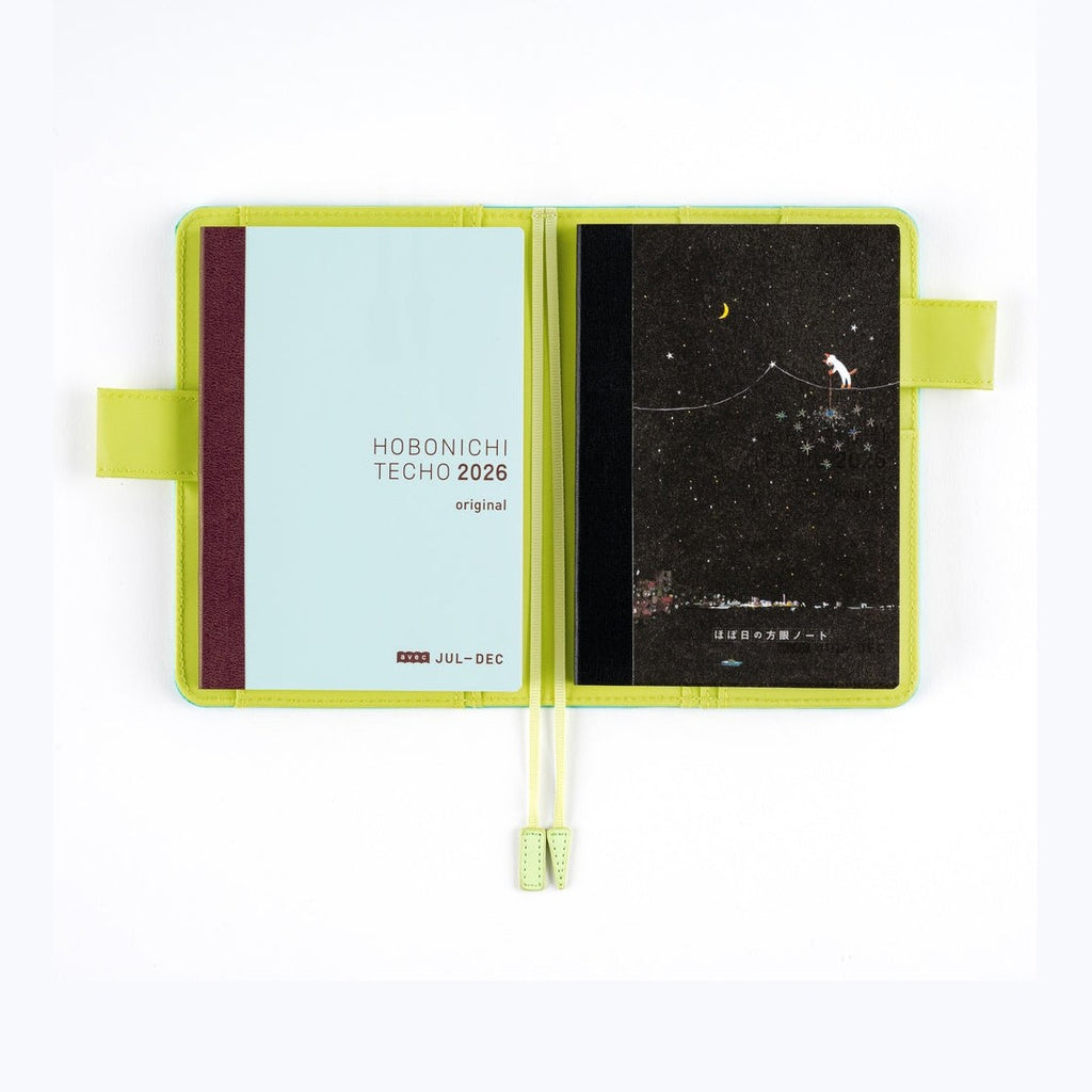 Open Hobonichi Graph Notebook A6 with lime green cover and night cat illustration