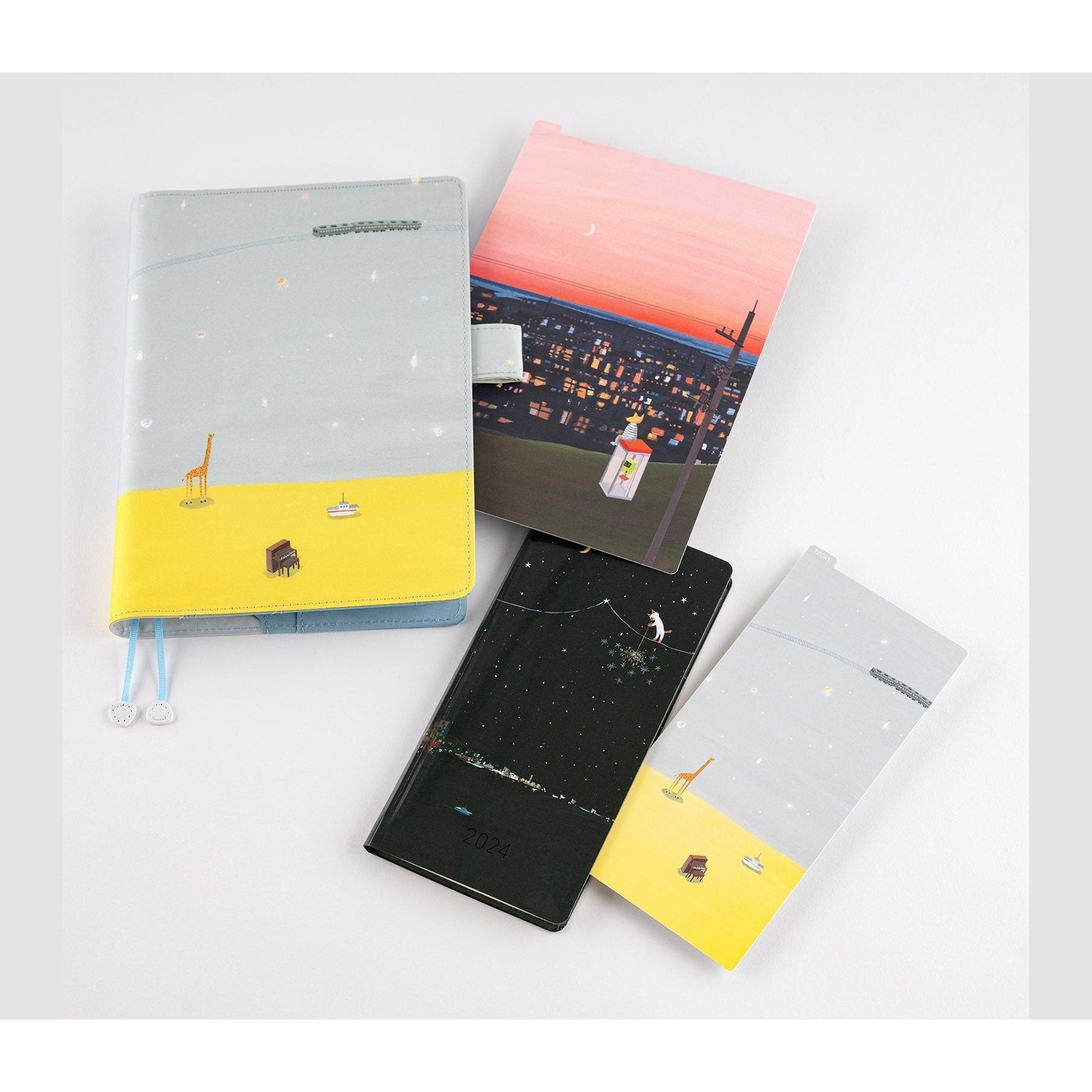 Hobonichi Techo Hiroko Kubota A5 pencil board with sunset cityscape and striped cat illustration