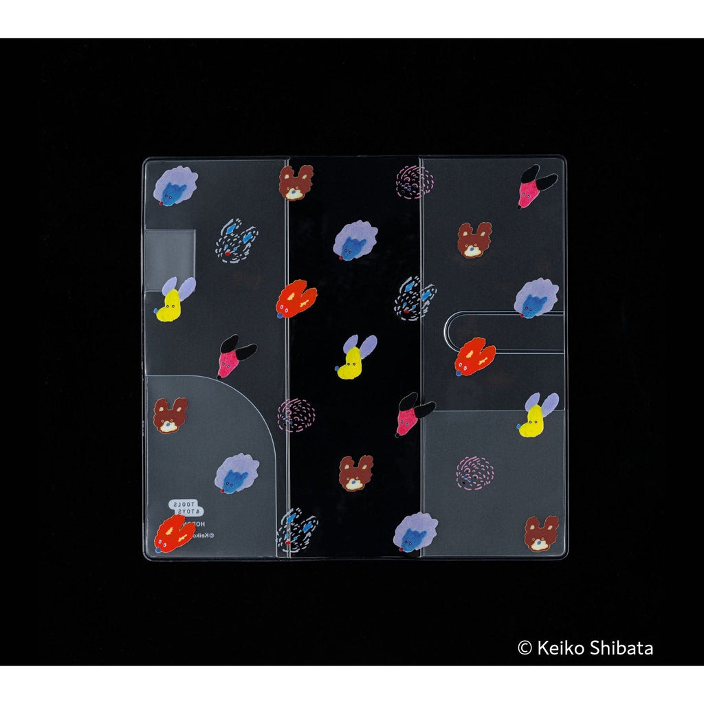 Clear PVC Hobonichi Techo cover with Keiko Shibata dog art on black background