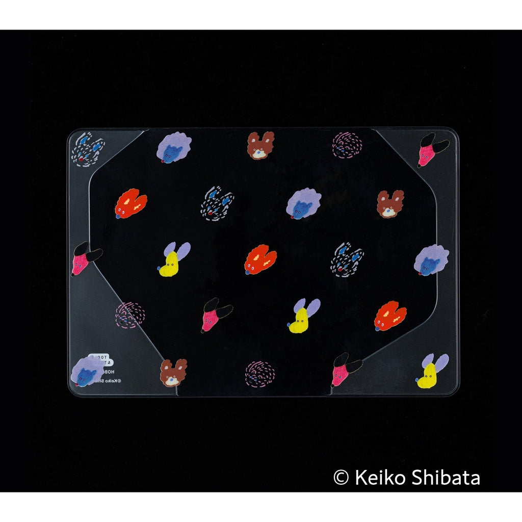 Clear PVC Hobonichi Techo cover featuring seven colorful dog head illustrations