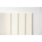 Folded Hobonichi Techo pages showing colored dot grid sections