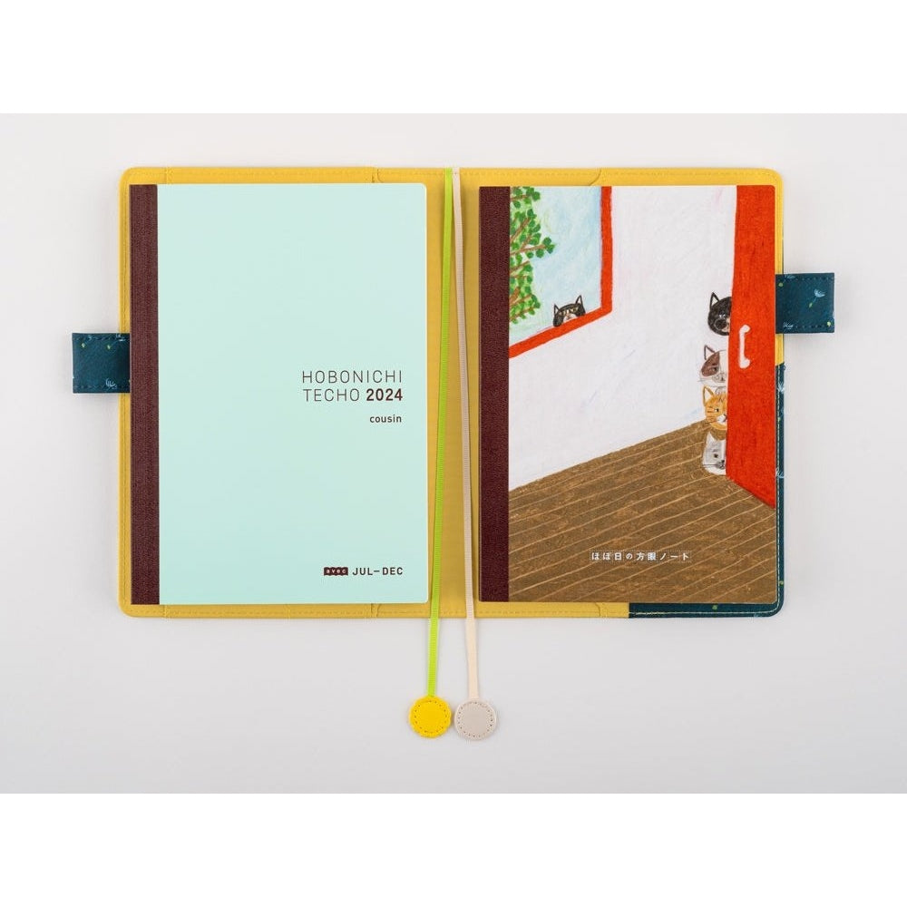 Open Hobonichi Techo cousin notebook with mint insert and cat flap