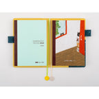 Open Hobonichi Techo cousin notebook with mint insert and cat flap