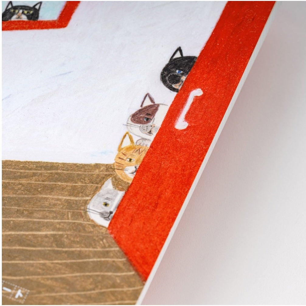 Close-up of Hobonichi Techo cat art detail on red door cover