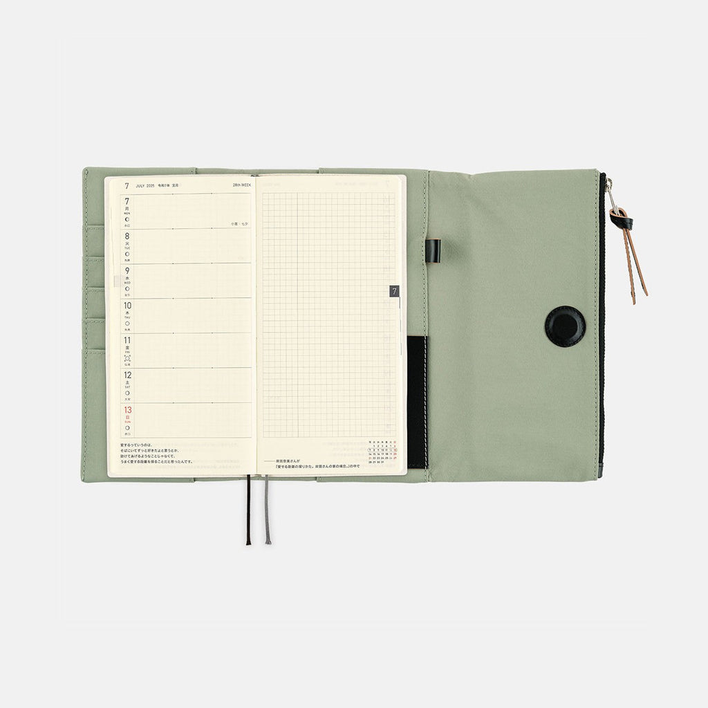 Weekly planner insert inside open Hobonichi Techo Weeks cover