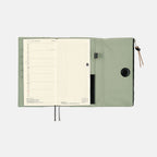 Weekly planner insert inside open Hobonichi Techo Weeks cover