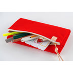 Red stationery cover holding highlighter, pens, ruler and sticky notes