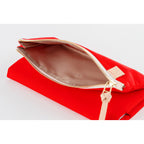 Red fabric cover open to reveal beige interior lining