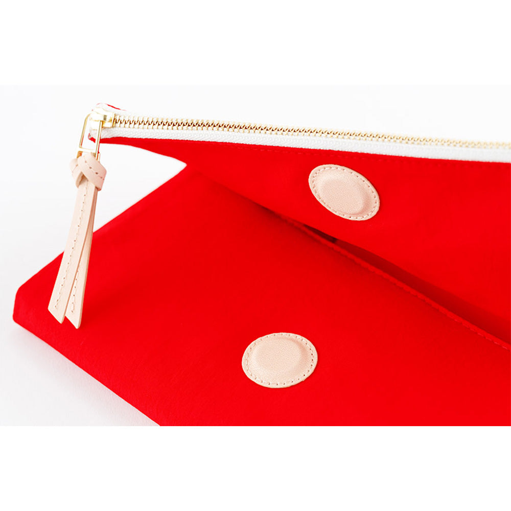 Close-up of red cover interior with dual circular leather patches
