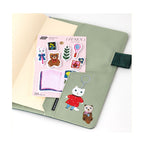 Green Hobonichi Techo cover with My Room sticker sheet and character stickers