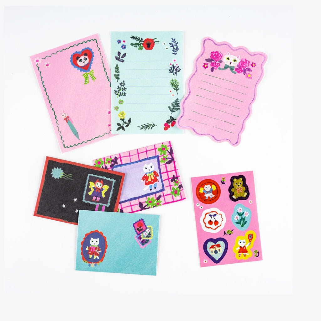 Hobonichi Techo Yumi Kitagishi White Cat mini letter set with panda, floral, and cat illustrations on textured paper
