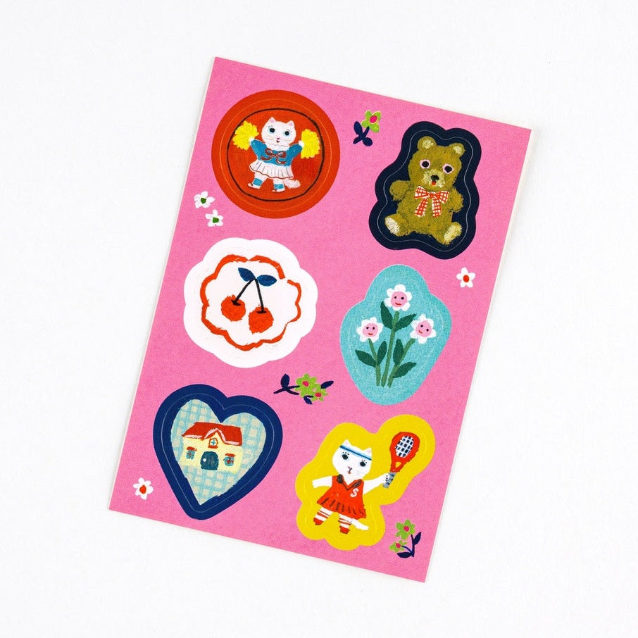 Die-cut sticker sheet from Yumi Kitagishi White Cat collection showing cats, bears, and cherries on matte paper