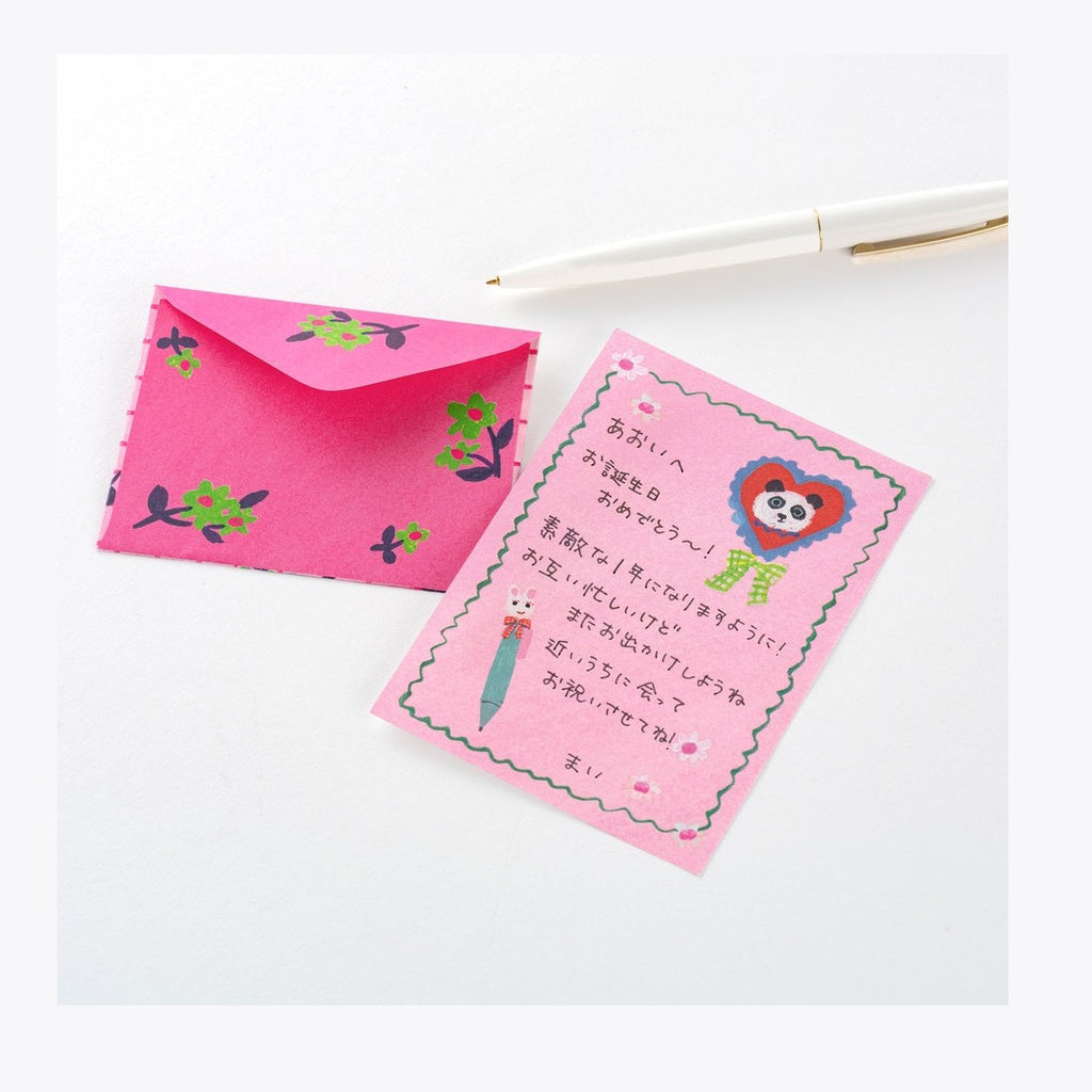 Pink floral envelope and matching notepad set with panda illustration and Japanese text for personal correspondence