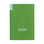 Green textured cover of Hobonichi Weekly 2026 pocket calendar with white text
