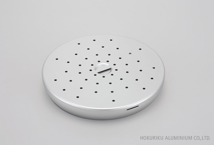 Close-up of Hokuriku anodised aluminium steamer insert showing steam holes