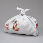 Goldfish patterned furoshiki cloth tied in a knot for gift wrapping