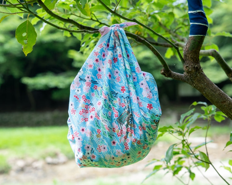 Hanging Kashiko sakura kasumi furoshiki cloth displaying traditional Japanese courtly design