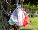 Kashiko Furoshiki drawstring bag view showing layered red purple organic shapes and berry motif details