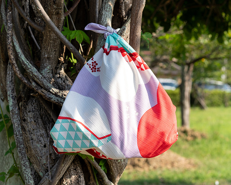 Kashiko Furoshiki drawstring bag view showing layered red purple organic shapes and berry motif details