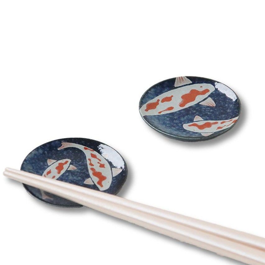 Koi nishikigoi round chopstick rests on white background