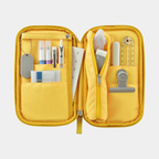 Open mustard yellow Kokuyo Pancase with days of week insert and organized pen compartments