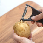Marna peeler removing potato eye with integrated tool