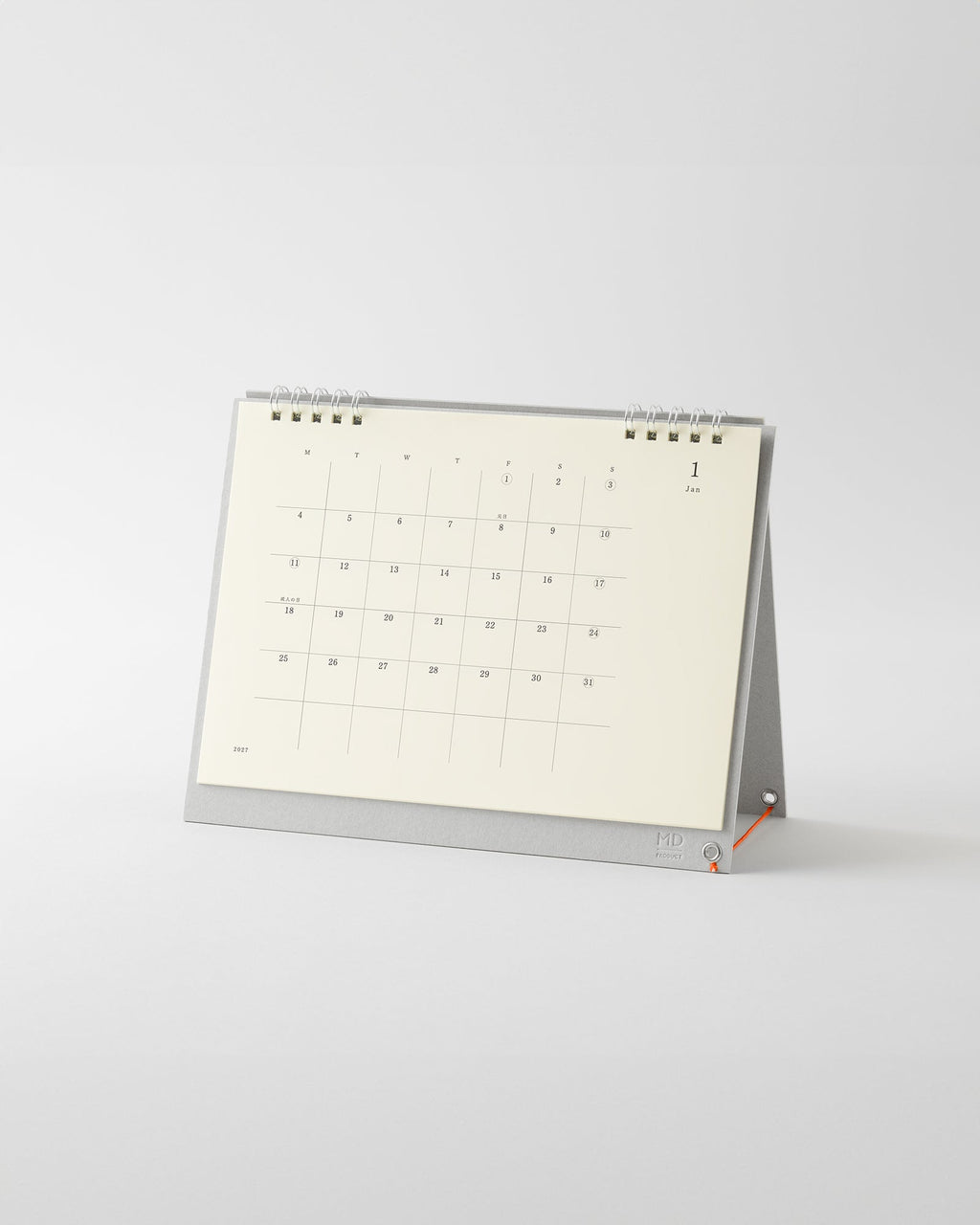 Midori MD Desk Calendar 2027 standing on its grey base with silver double ring binding