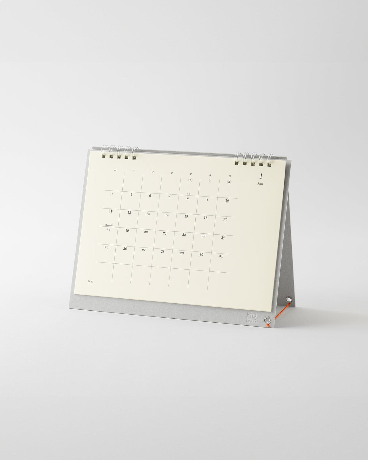 Midori MD Desk Calendar 2027 standing on its grey base with silver double ring binding