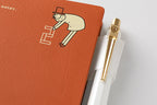 Close-up of Ojisan character illustration on terracotta Midori 2027 diary cover