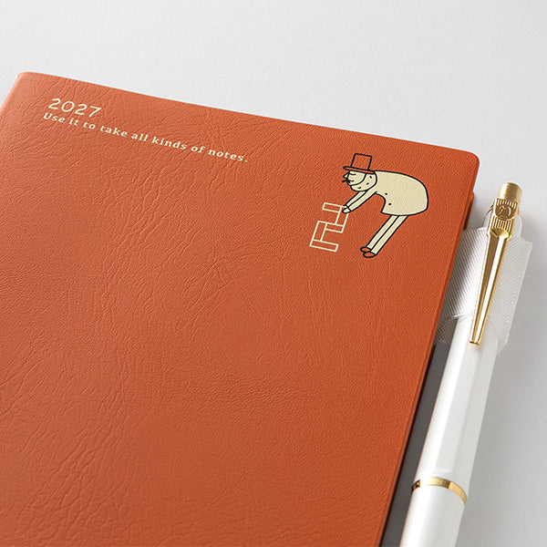 Midori Ojisan 2027 A6 diary cover detail with gold foil text and mascot illustration