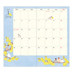 Midori 2027 diary cover close-up showing diverse bird species among pink tulips
