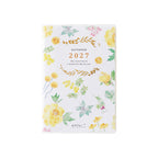 Front view of Midori Datebook 2027 with scattered yellow peony and mimosa watercolor florals on white cover