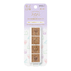 Midori Yuru Log pre-inked stamp set with flower, pen, book, and camera designs in pink, blue, green, and purple