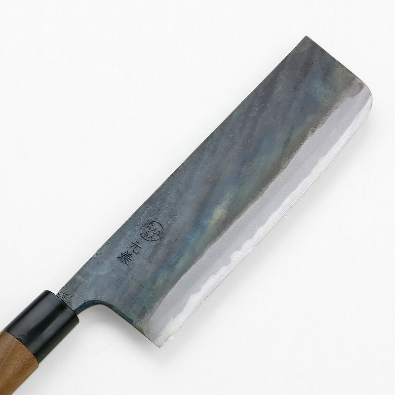 Motokane Aogami #1 Nakiri knife blade close-up showing kurouchi finish and polished bevel