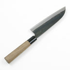 Motokane Santoku knife showing black hammer-forged blade and polished bevel