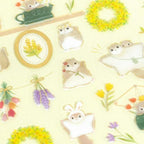 Close-up of NB momonga stickers showing gold foil membrane and glossy PET film finish