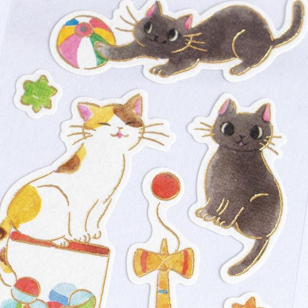 NB Nekorobi Retro Seal sticker detail showing gold foil accents on die-cut cat and dagashi illustrations