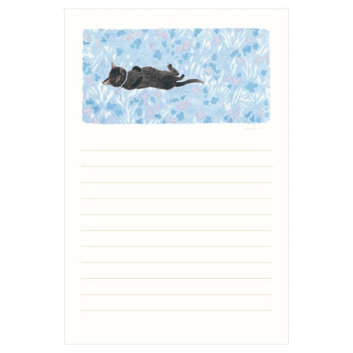 Cream letter sheet featuring stretching black cat and floral watercolor design