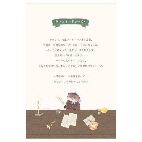 NB letter pad product info card featuring otter writing at desk with candle