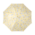 Overhead view of pale yellow floral patterned dome umbrella