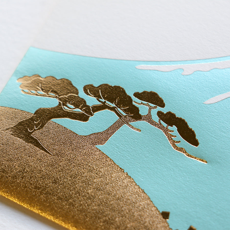 Close-up of textured gold foil stamping on Rokkaku mountain envelope