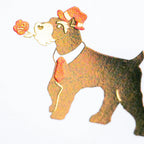 Close-up of foil-stamped schnauzer illustration on hexagonal card