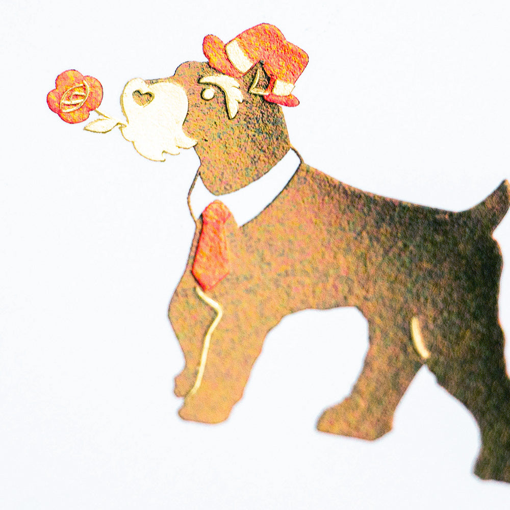 Close-up of foil-stamped schnauzer illustration on hexagonal card
