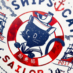Detail view of red lifebuoy ring and nautical text on ship's cat postcard